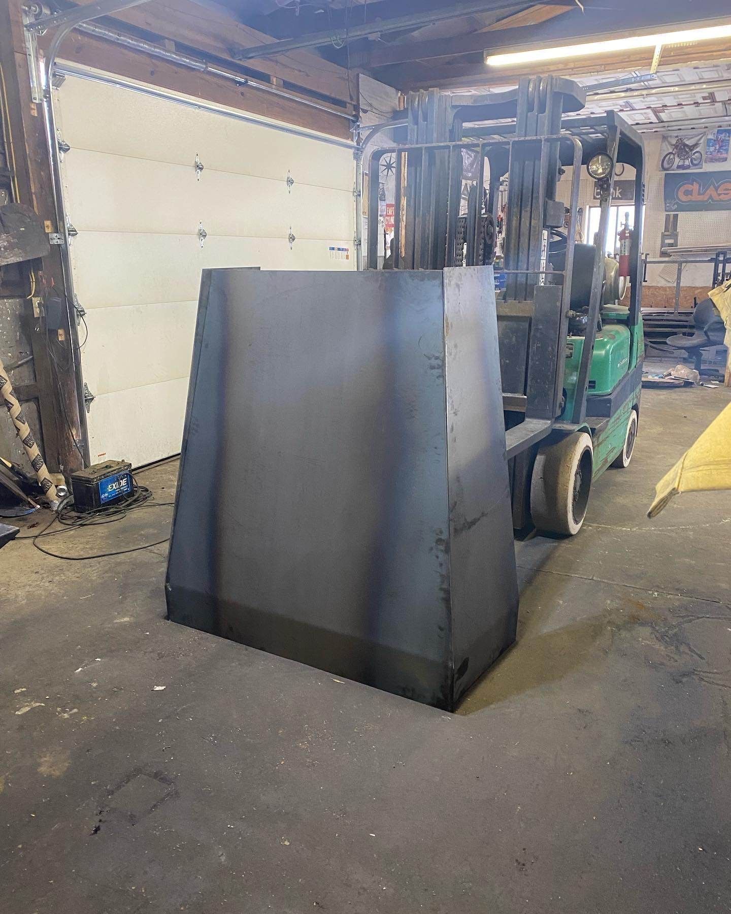 Hand-forged mortise and tenon steel joinery on a custom range hood
