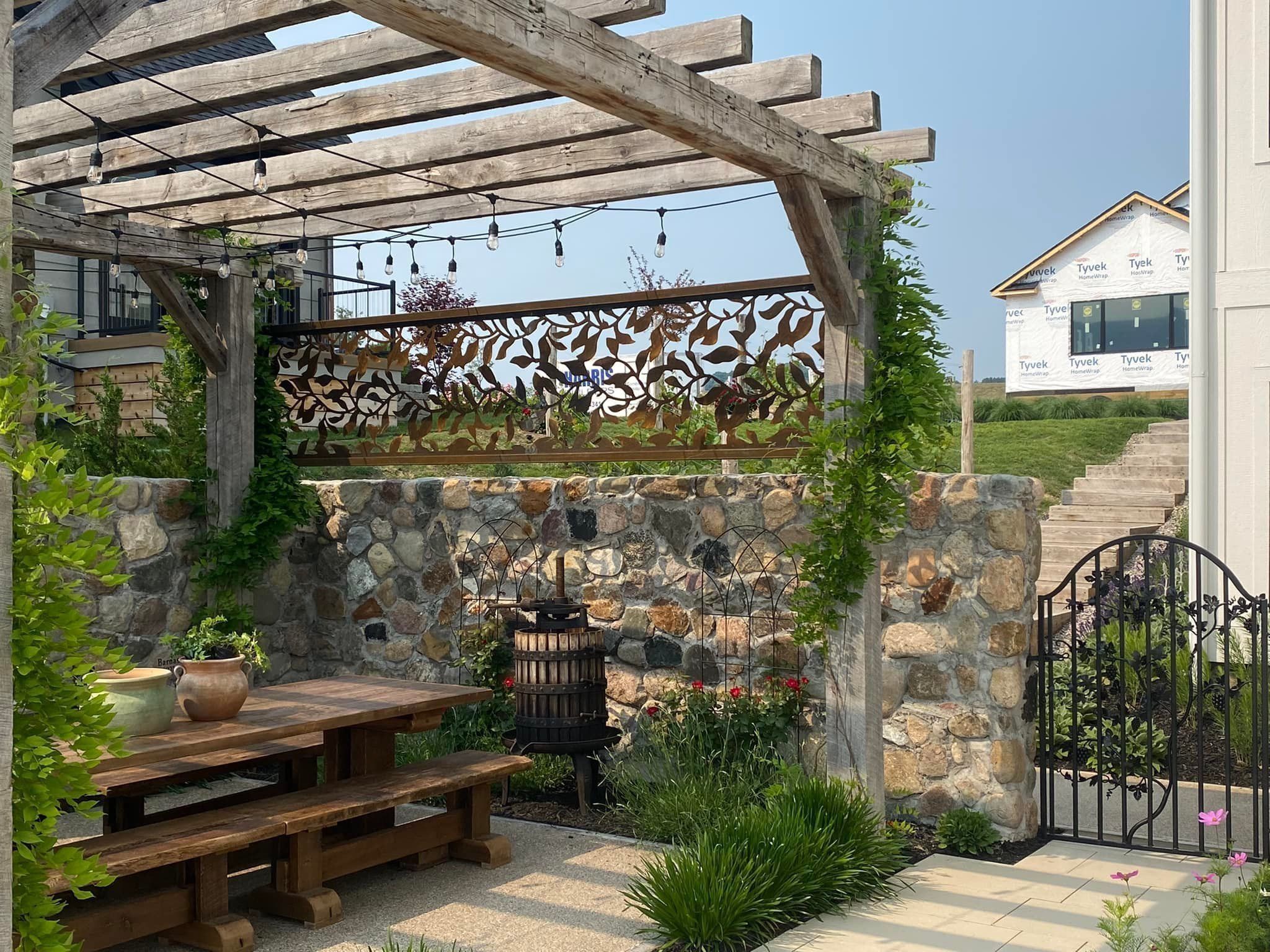 Custom hand-forged floral steel railing on a Northern Michigan lakefront deck